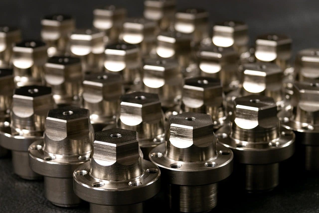 Rows of precision machined metal parts, ready to ship from a manufacturing plant