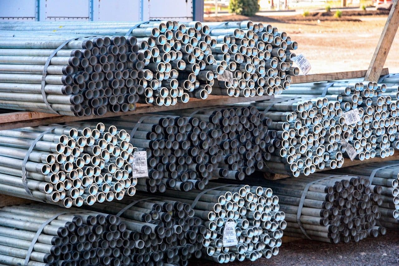 Bundles of steel pipes stacked in a stockyard