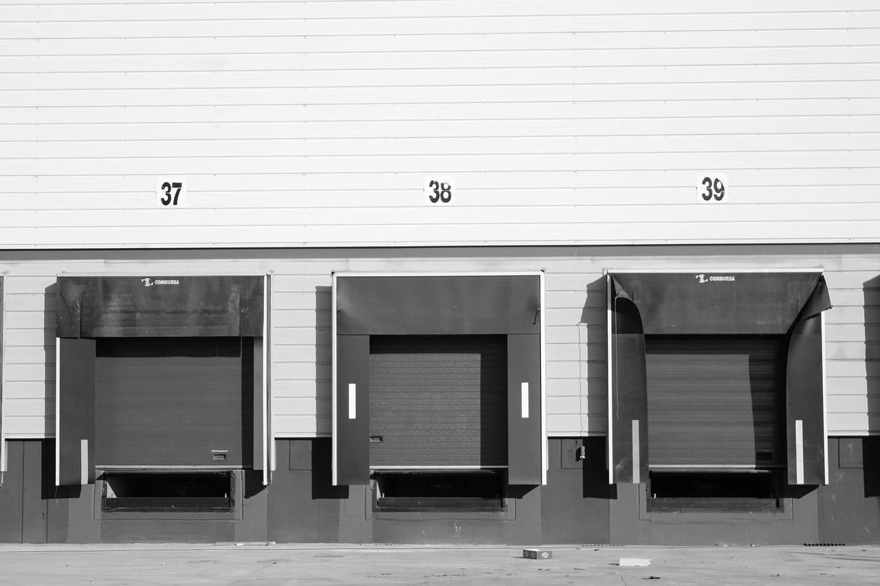 Loading dock doors at an industrial warehouse, where a manufacturer's orders finally leave the building